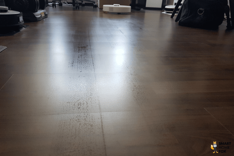 Roborock Q7 Max mops the floor in the study.